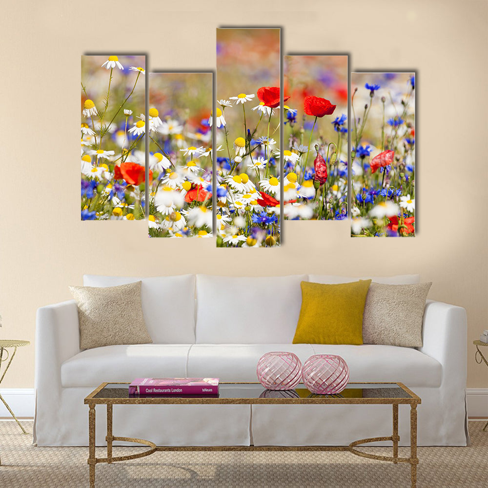 Abundance of blooming wild flowers on the meadow at spring time Multi Panel Canvas Wall Art