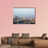 Noida Delhi cityscape with skyscrapers, small houses and metro multi panel canvas wall art