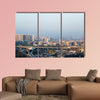 Noida Delhi cityscape with skyscrapers, small houses and metro multi panel canvas wall art