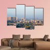 Noida Delhi cityscape with skyscrapers, small houses and metro multi panel canvas wall art