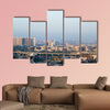 Noida Delhi cityscape with skyscrapers, small houses and metro multi panel canvas wall art