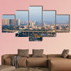 Noida Delhi cityscape with skyscrapers, small houses and metro multi panel canvas wall art