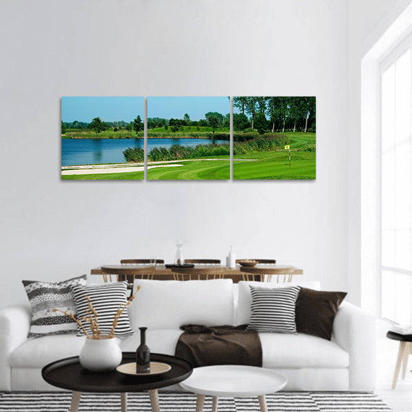 Golf field with green, lake, sand and hole 17 flag Panoramic Canvas Wall Art