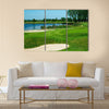 Golf field with green, lake, sand and hole 17 flag Multi Panel Canvas Wall Art