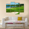 Golf field with green, lake, sand and hole 17 flag Multi Panel Canvas Wall Art