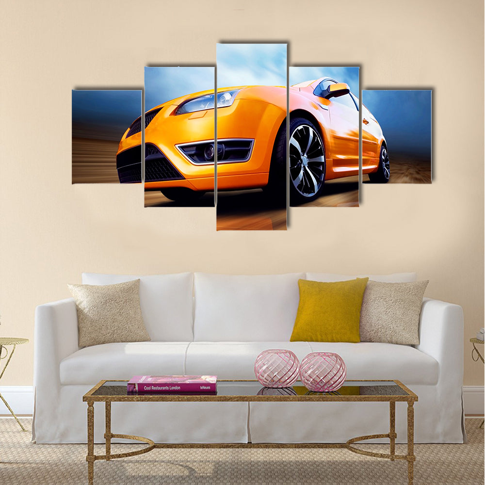 Beautiful orange sport car on road Multi panel canvas wall art