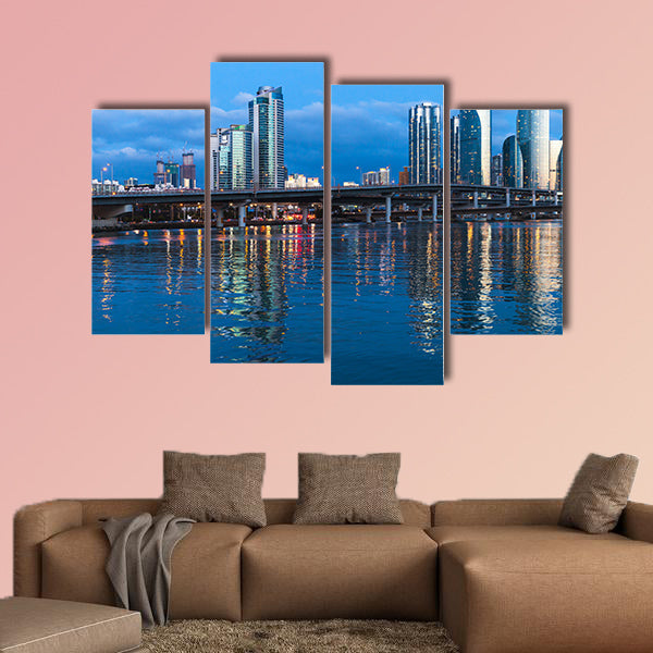 Marine City at night, panoramic skyline of luxury skyscrapers multi panel canvas wall art