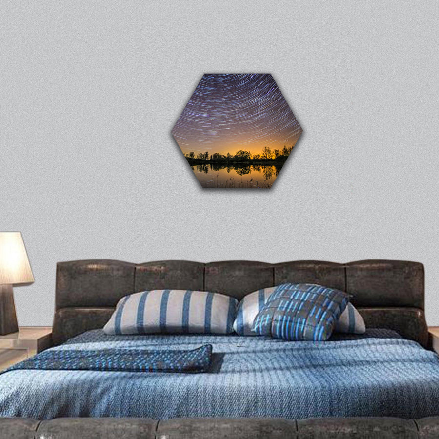 Colorful star trails with reflection in lake hexagonal canvas wall art