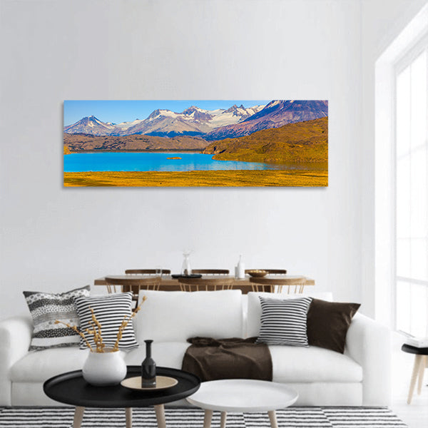 A mirror lake with icy water panoramic canvas wall art.