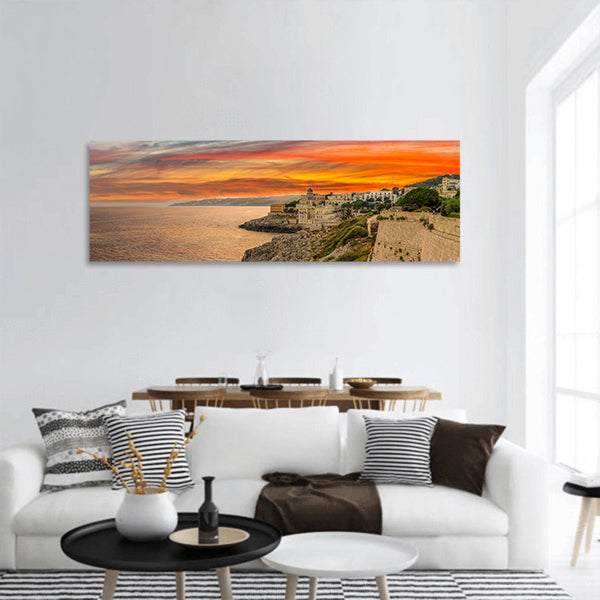 Sunset on town on the coast panoramic canvas wall art