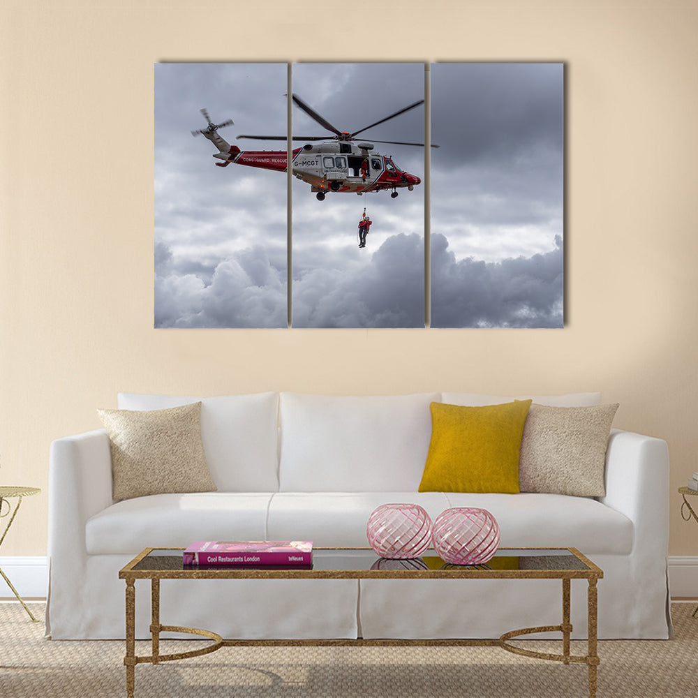 A coastguard helicopter dropping off mountain rescue team members multi panel canvas wall art
