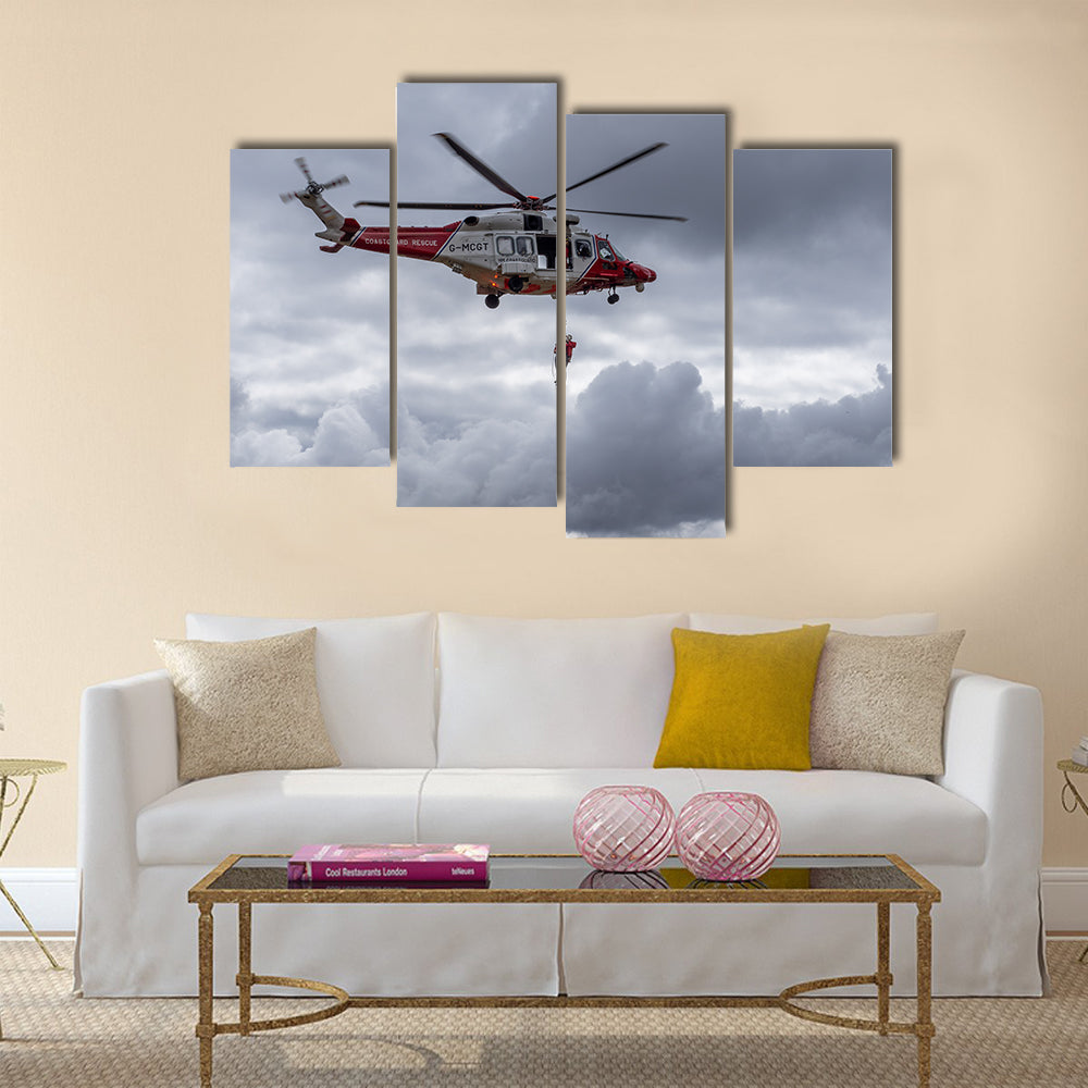 A coastguard helicopter dropping off mountain rescue team members multi panel canvas wall art