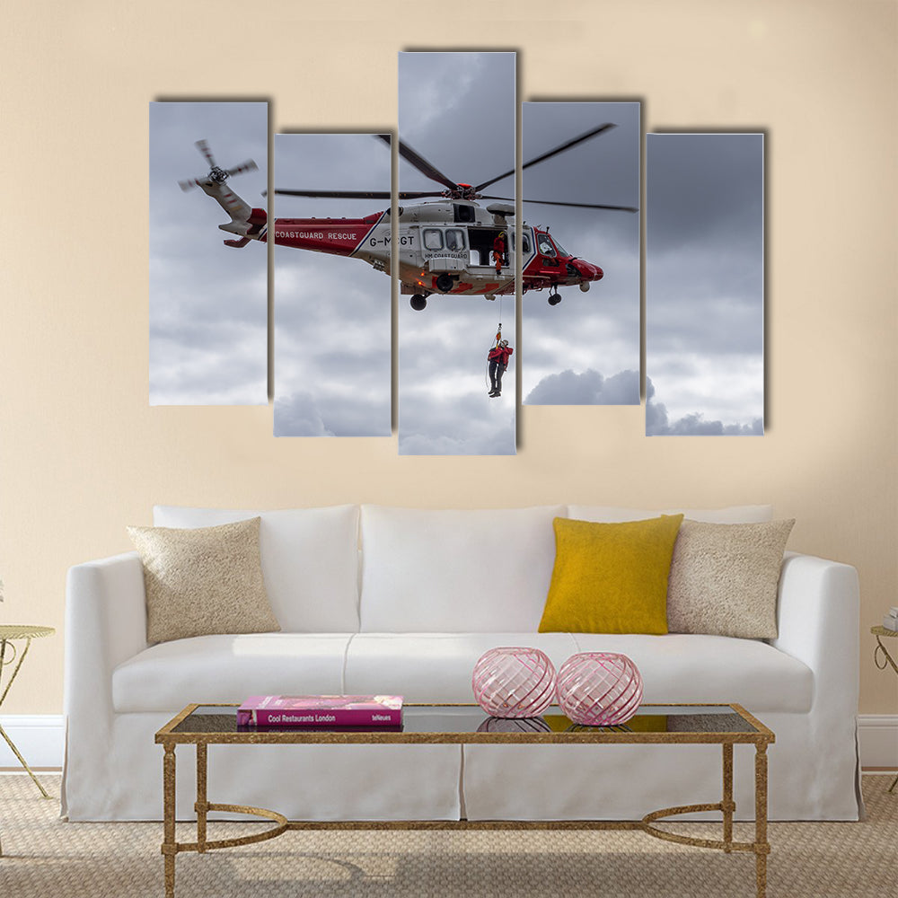 A coastguard helicopter dropping off mountain rescue team members multi panel canvas wall art