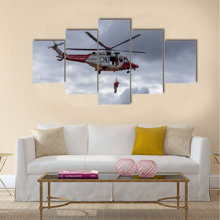 A coastguard helicopter dropping off mountain rescue team members multi panel canvas wall art