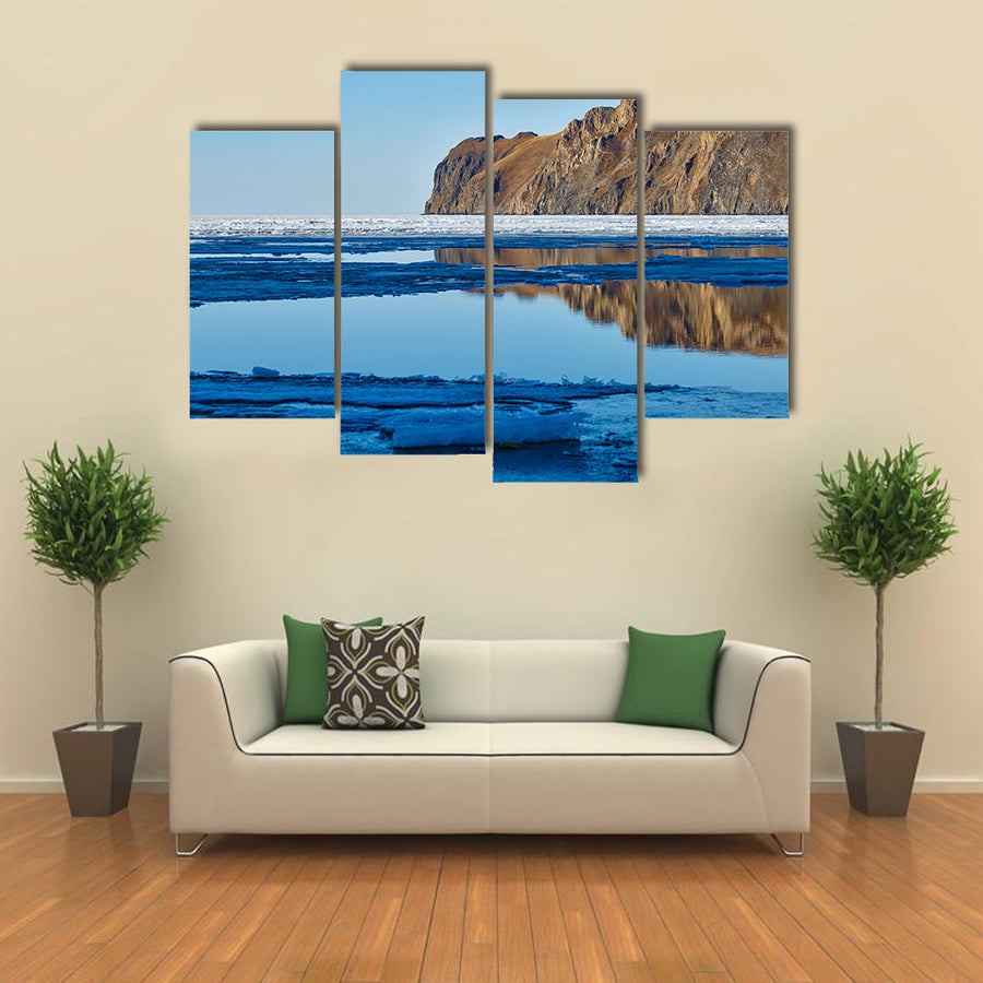 Red rock at Baikal Lake with melting ice Multi panel canvas wall art