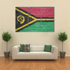 Vanuatu flag is painted onto an old brick wall Multi panel canvas wall art