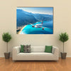 Landscape with white passenger airplane, sky, islands and blue water Multi panel canvas wall art