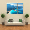 Landscape with white passenger airplane, sky, islands and blue water Multi panel canvas wall art