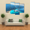 Landscape with white passenger airplane, sky, islands and blue water Multi panel canvas wall art