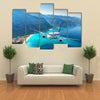 Landscape with white passenger airplane, sky, islands and blue water Multi panel canvas wall art