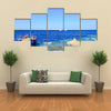 Visitors at snorkelling in the sea during the surf Multi panel canvas wall art