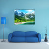 Beautiful summer Alpine mountain lake view and sunshine in sky multi panel canvas wall art