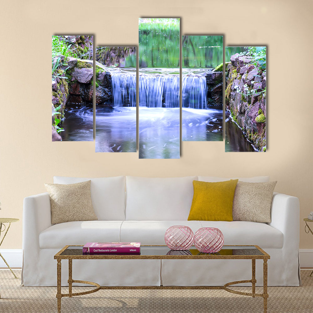 Small waterfall on a small picturesque brook in the forest Multi panel canvas wall art