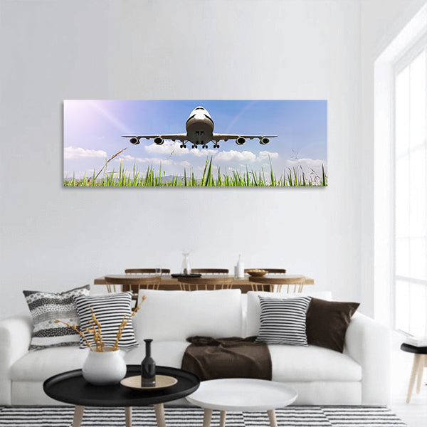 Airplane take off on the blue sky panoramic canvas wall art