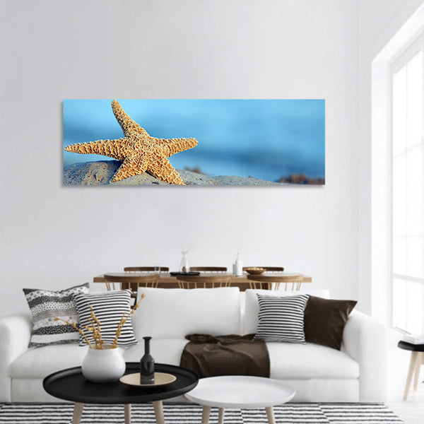 Beautiful starfish on sandy beach panoramic canvas wall art
