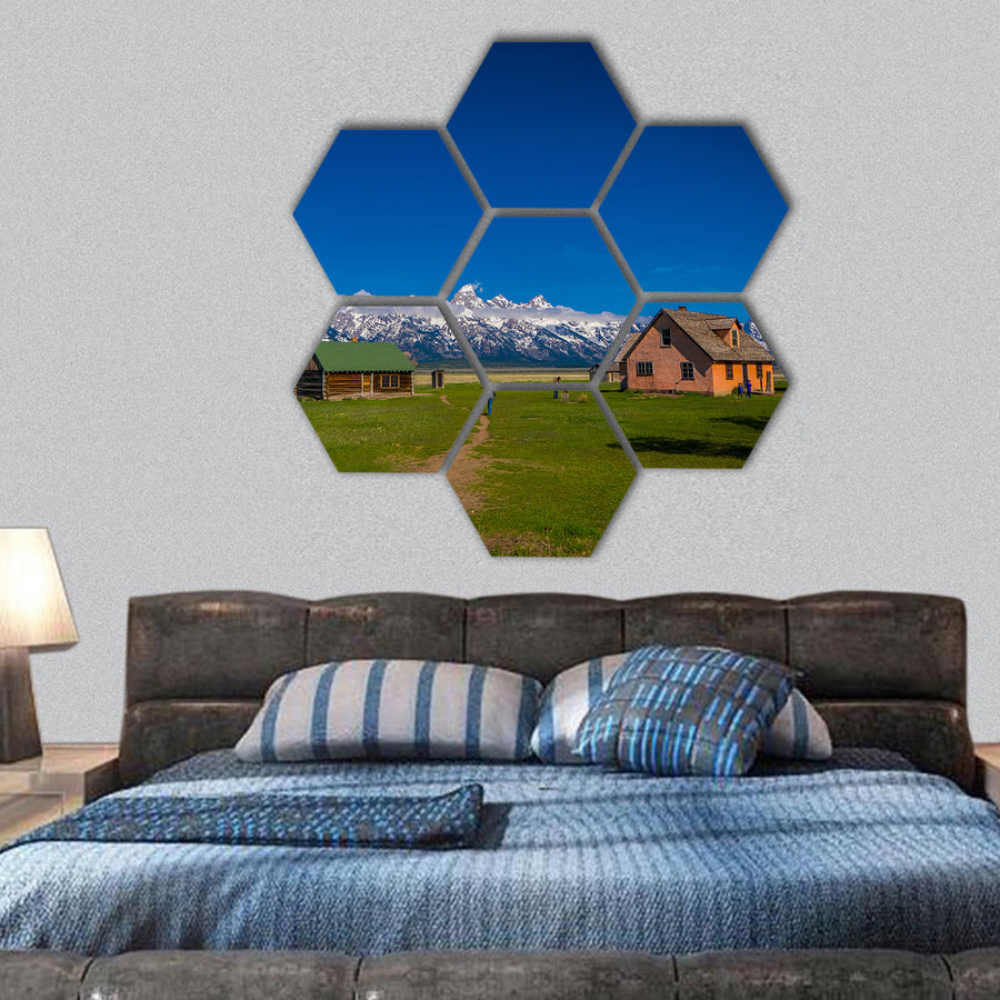 Old mormon barn in Grand Teton Mountains with low clouds hexagonal canvas wall art
