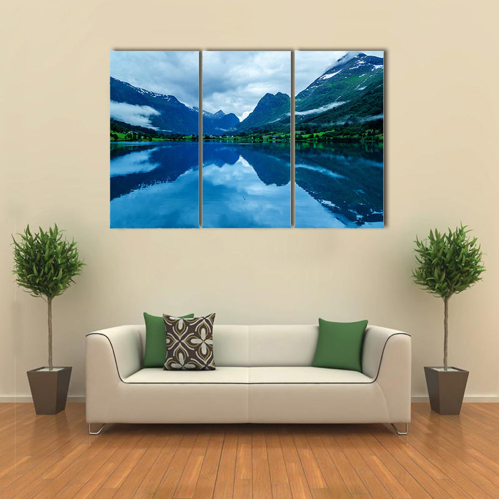 Lake in Norwegian fjords with reflection cloudy Multi panel canvas wall art