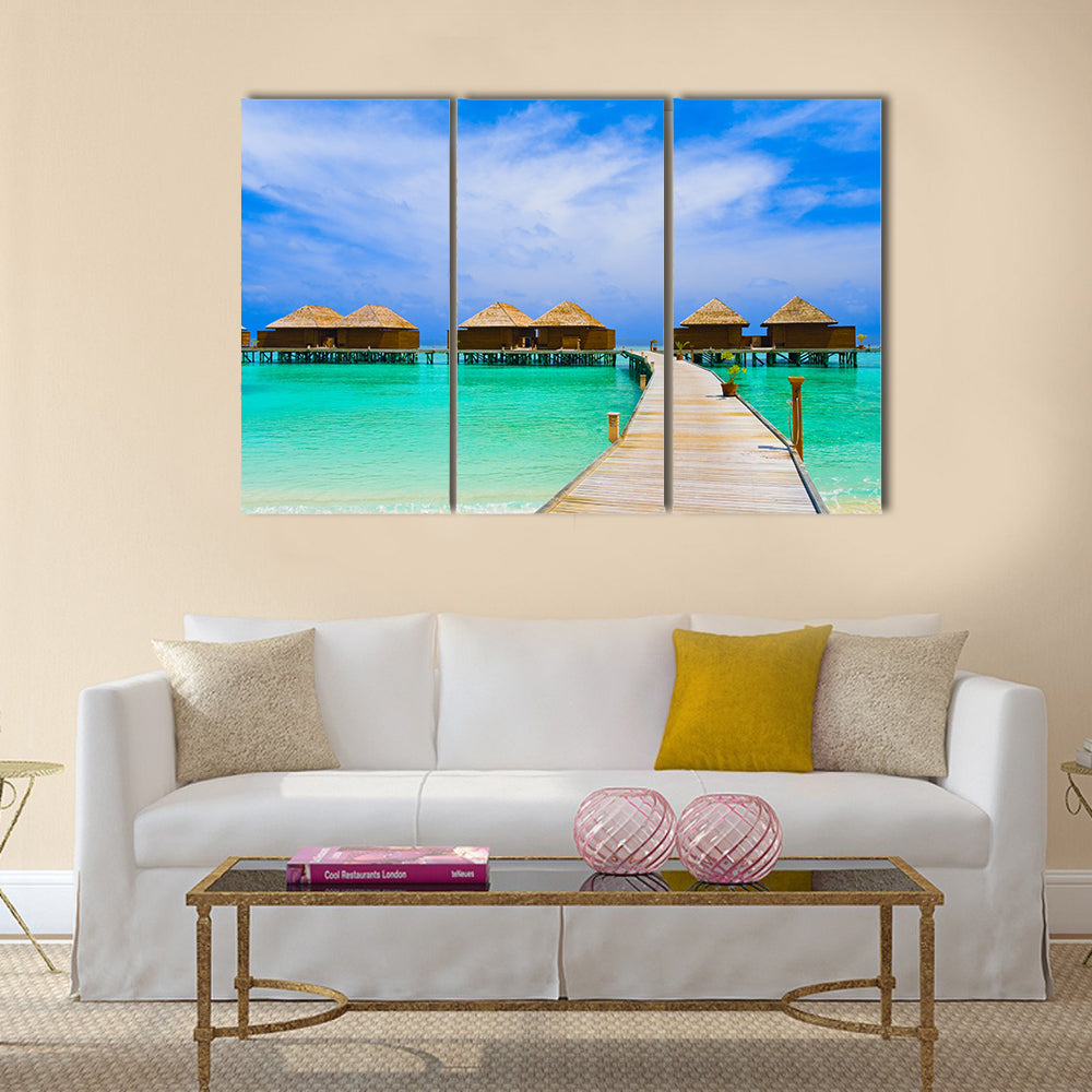 Water bungalows at a tropical island - travel background multi panel canvas wall art