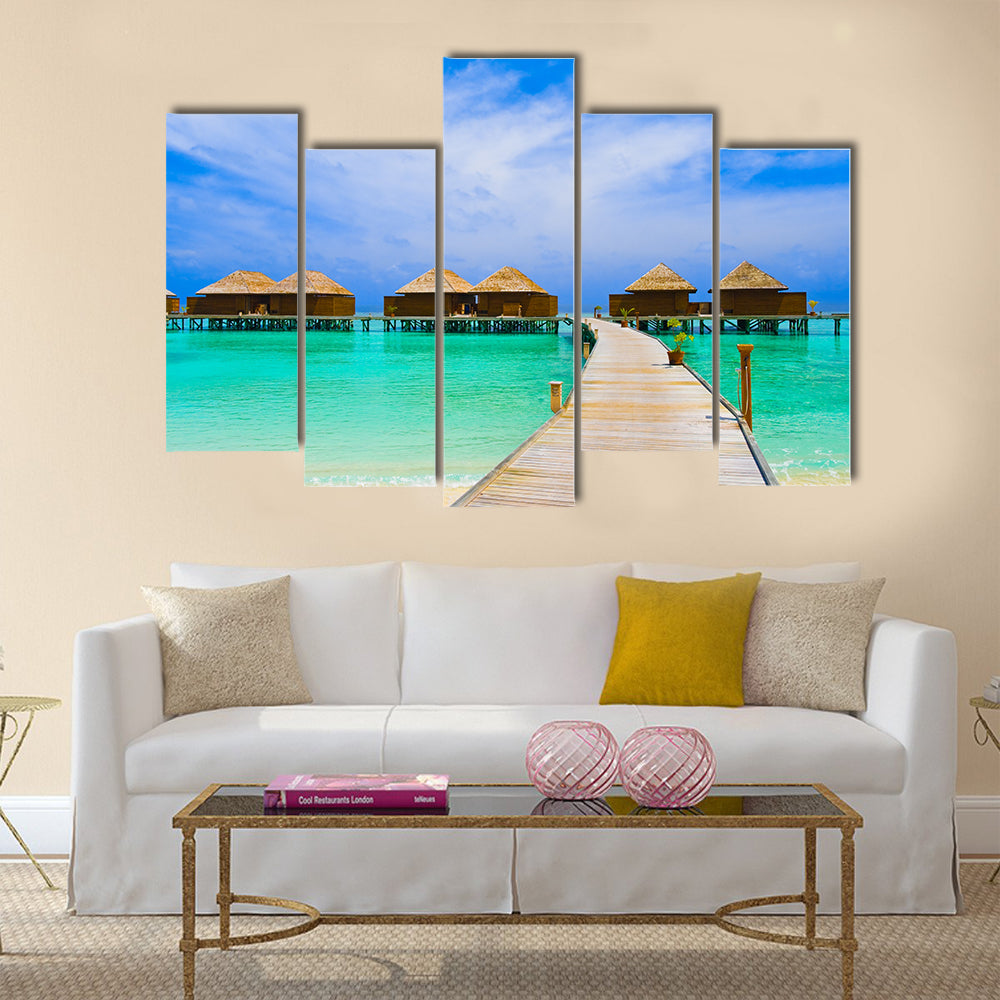 Water bungalows at a tropical island - travel background multi panel canvas wall art