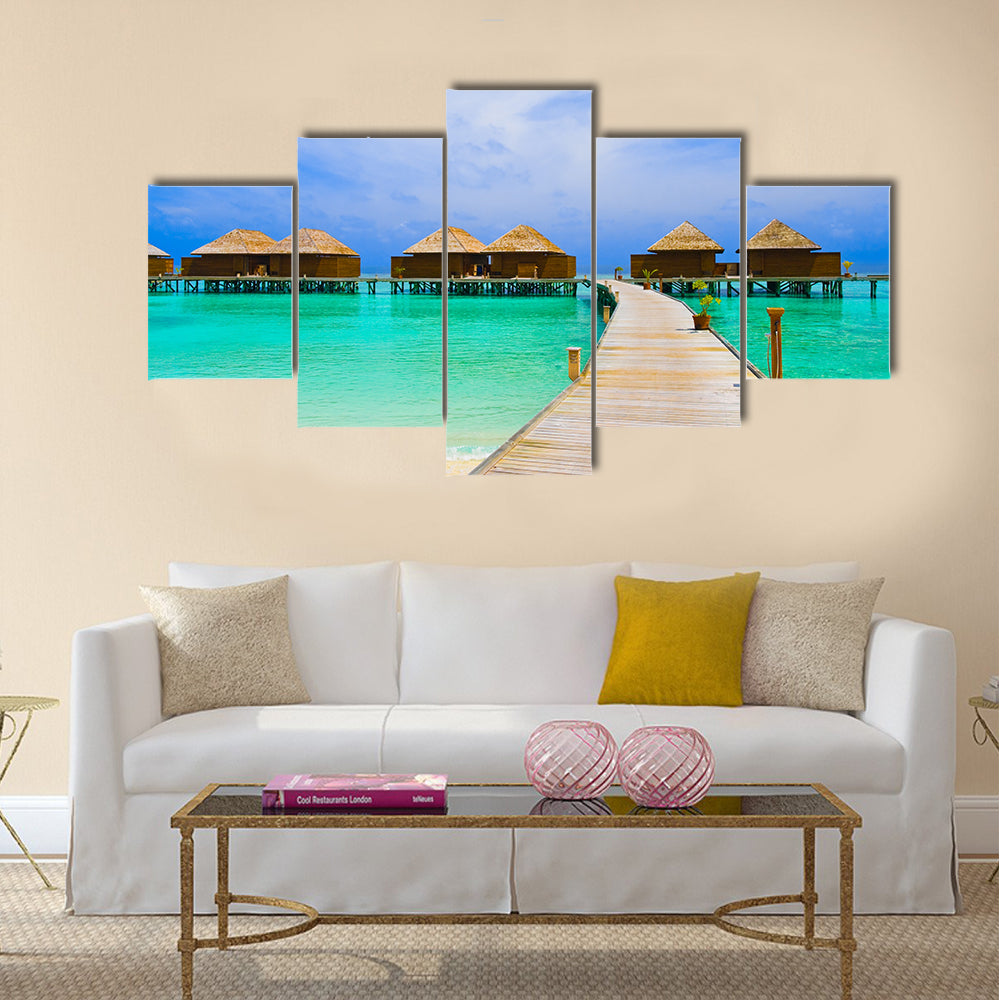 Water bungalows at a tropical island - travel background multi panel canvas wall art