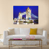 The iconic Tower Bridge of London lit up at night over the River Thames Multi panel canvas wall art