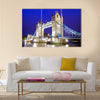 The iconic Tower Bridge of London lit up at night over the River Thames Multi panel canvas wall art