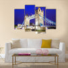 The iconic Tower Bridge of London lit up at night over the River Thames Multi panel canvas wall art