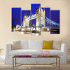 The iconic Tower Bridge of London lit up at night over the River Thames Multi panel canvas wall art