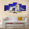 The iconic Tower Bridge of London lit up at night over the River Thames Multi panel canvas wall art