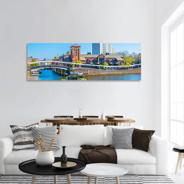 Restaurant alongside a water channel panoramic canvas wall art