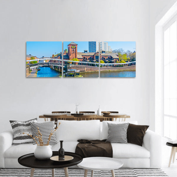 Restaurant alongside a water channel panoramic canvas wall art