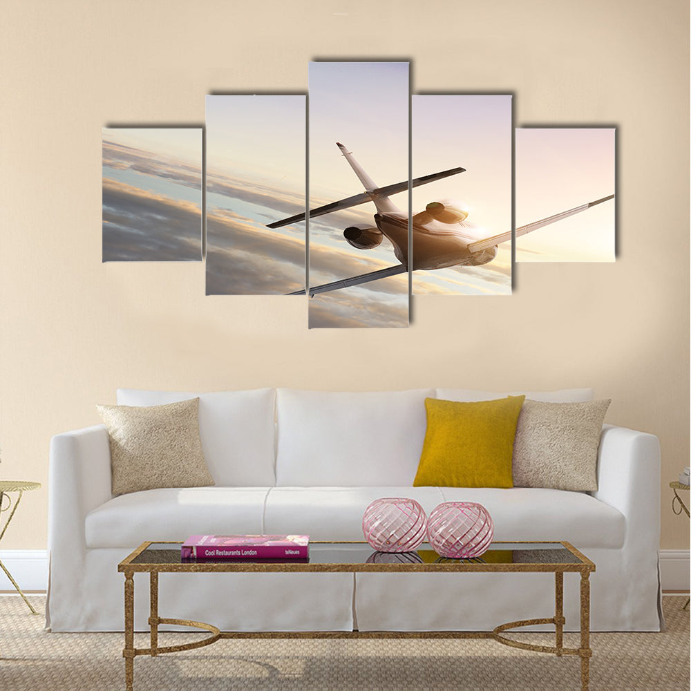 Commercial airliner flying in high sky multi panel canvas wall art