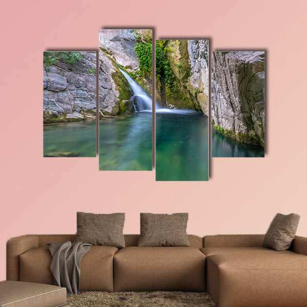 A small picturesque waterfall in a cozy mountain lagoon Multi panel canvas wall art