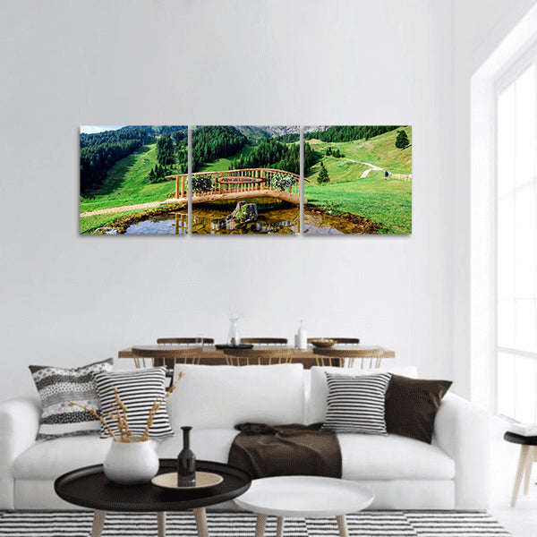 Small wooden bridge with a pond panoramic canvas wall art