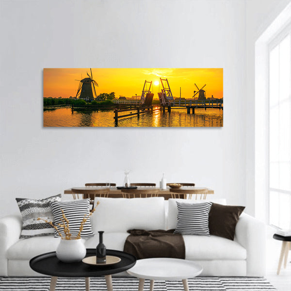 Sunset above a historic drawbridge panoramic canvas wall art