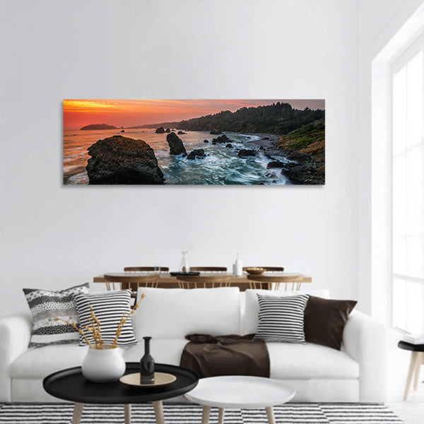 Sunset at a Rocky Beach panoramic canvas wall art.