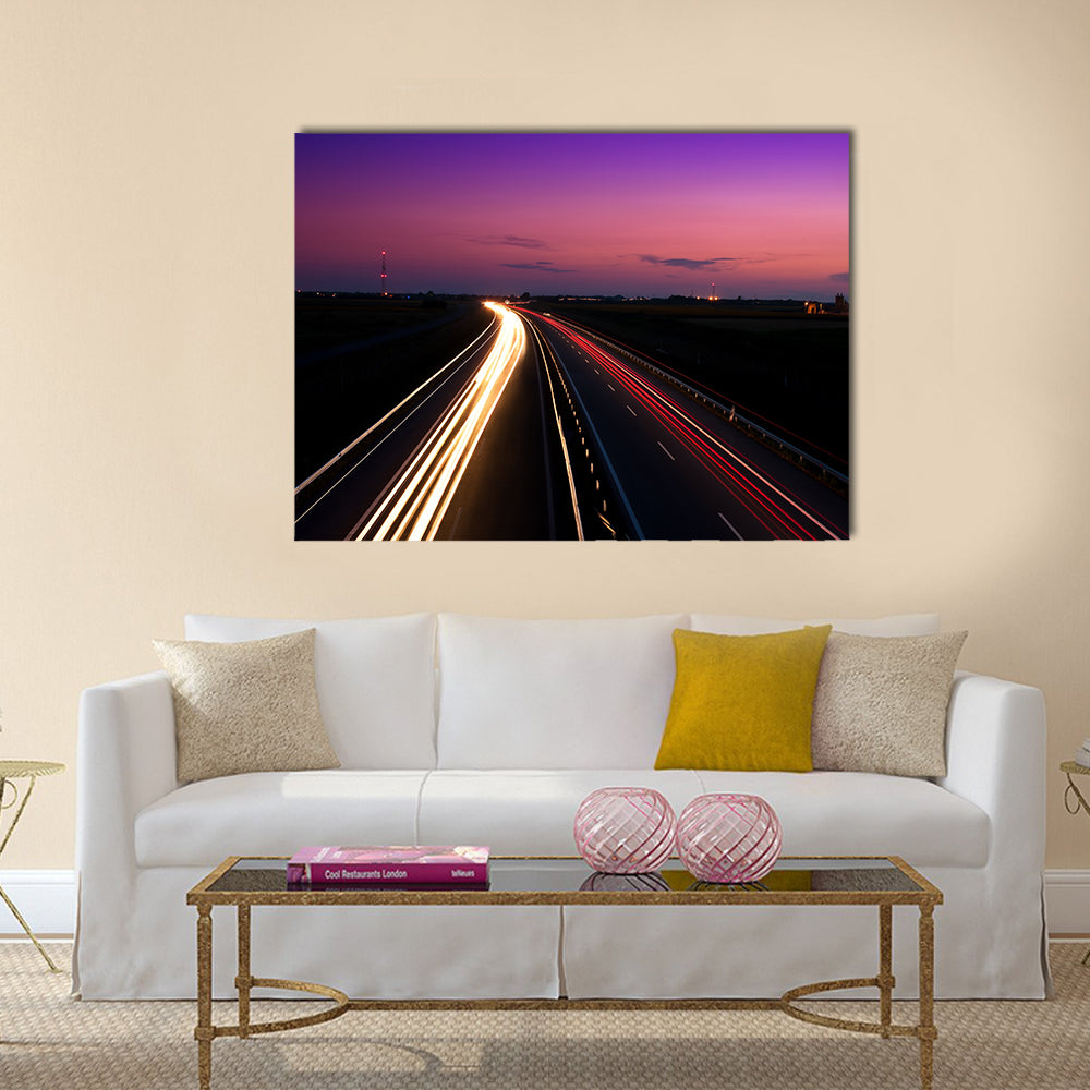 Cars speeding on a highway Multi Panel Canvas Wall Art