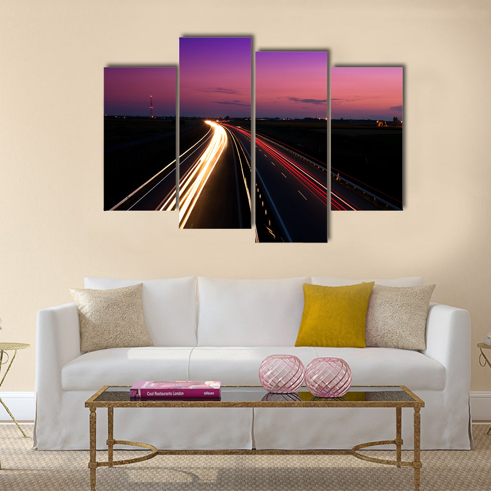 Cars speeding on a highway Multi Panel Canvas Wall Art