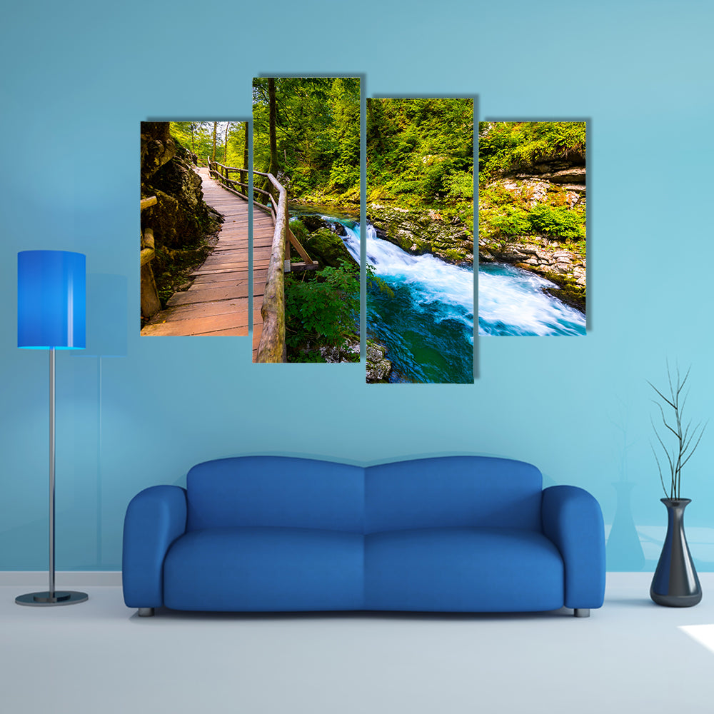 A river near the Bled lake with wooden tourist paths and wild trees Multi Panel Canvas Wall Art