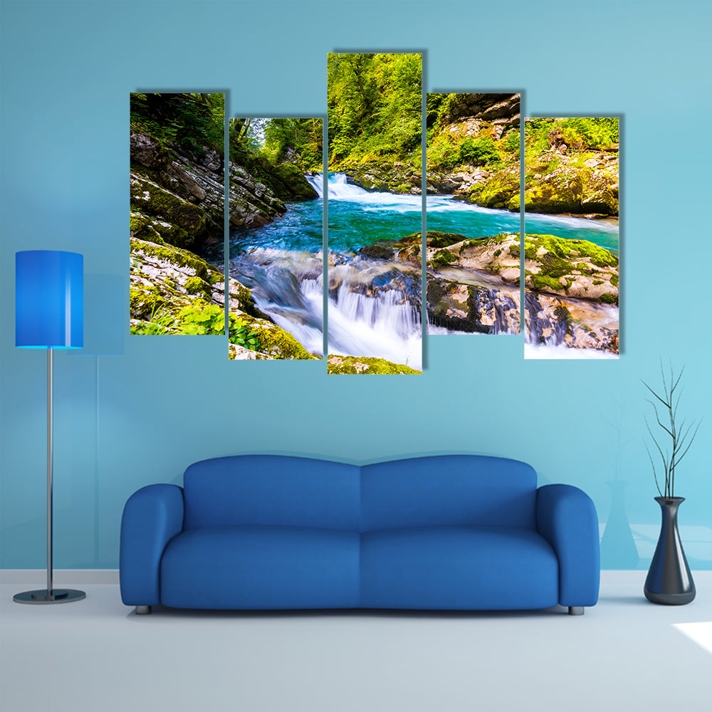 River near the Bled Lake with wooden tourist paths and bridges above river and waterfalls Multi Panel Canvas Wall Art